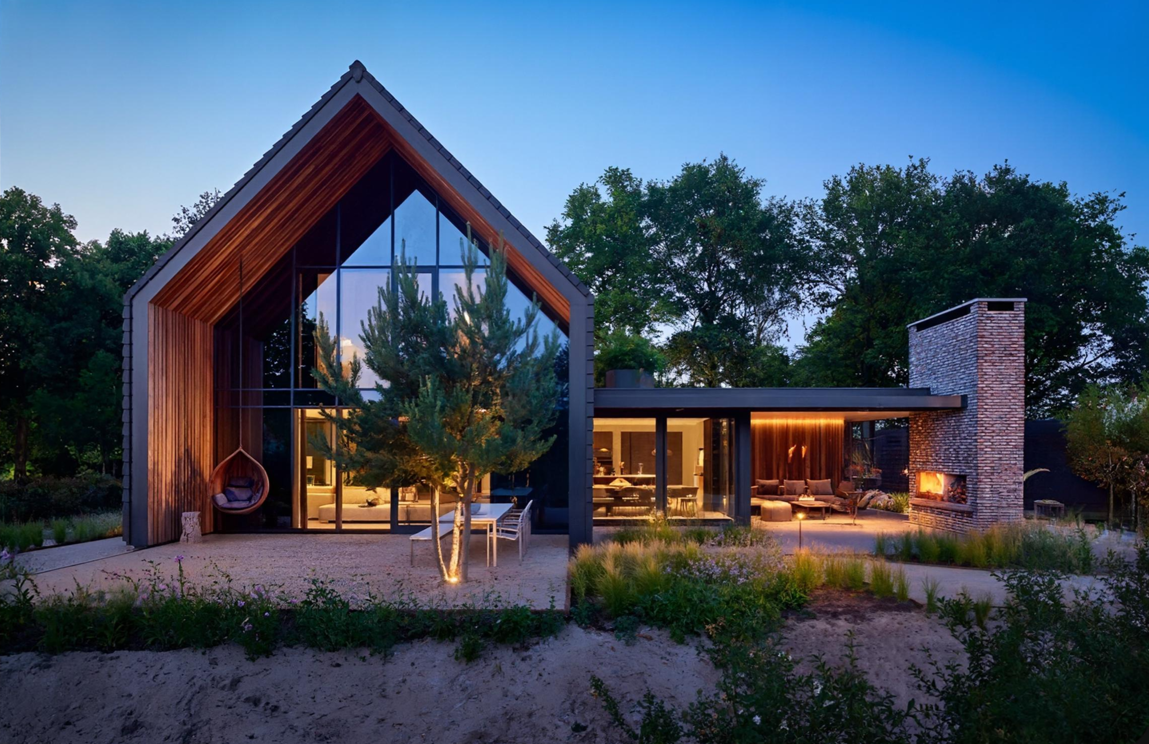 Contemporary mid-sized home at dusk