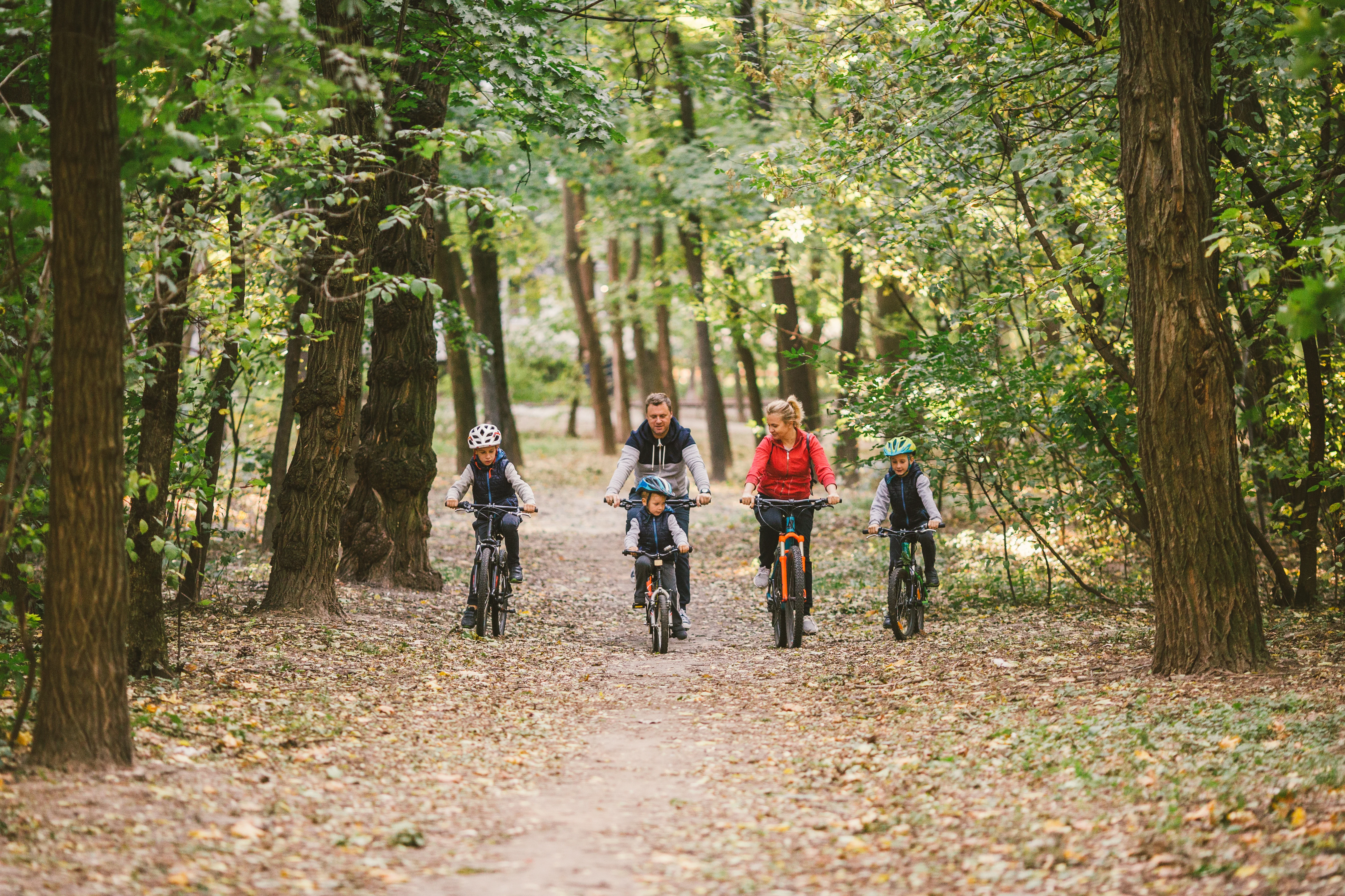 Family biking along the preserve paths