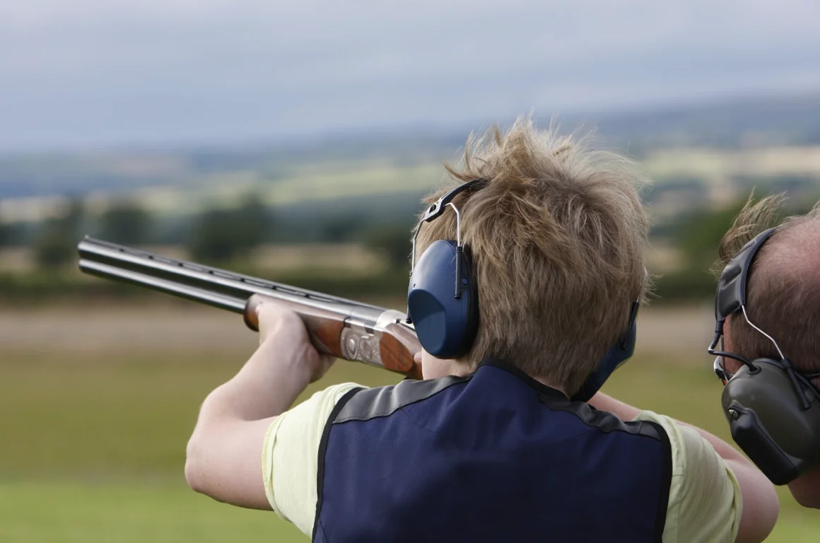 Youth learning sporting clays