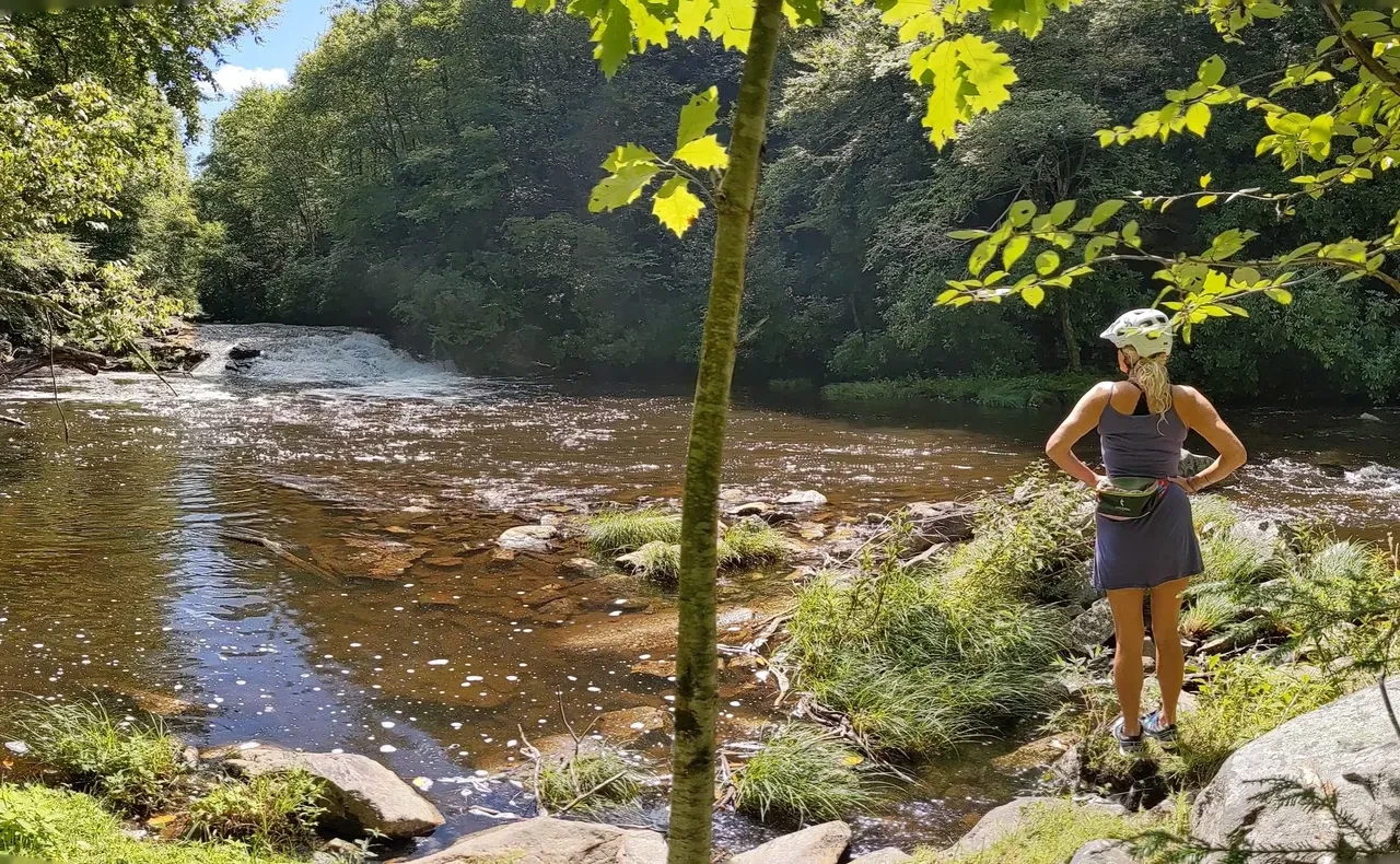 Woman wading in the trout stream