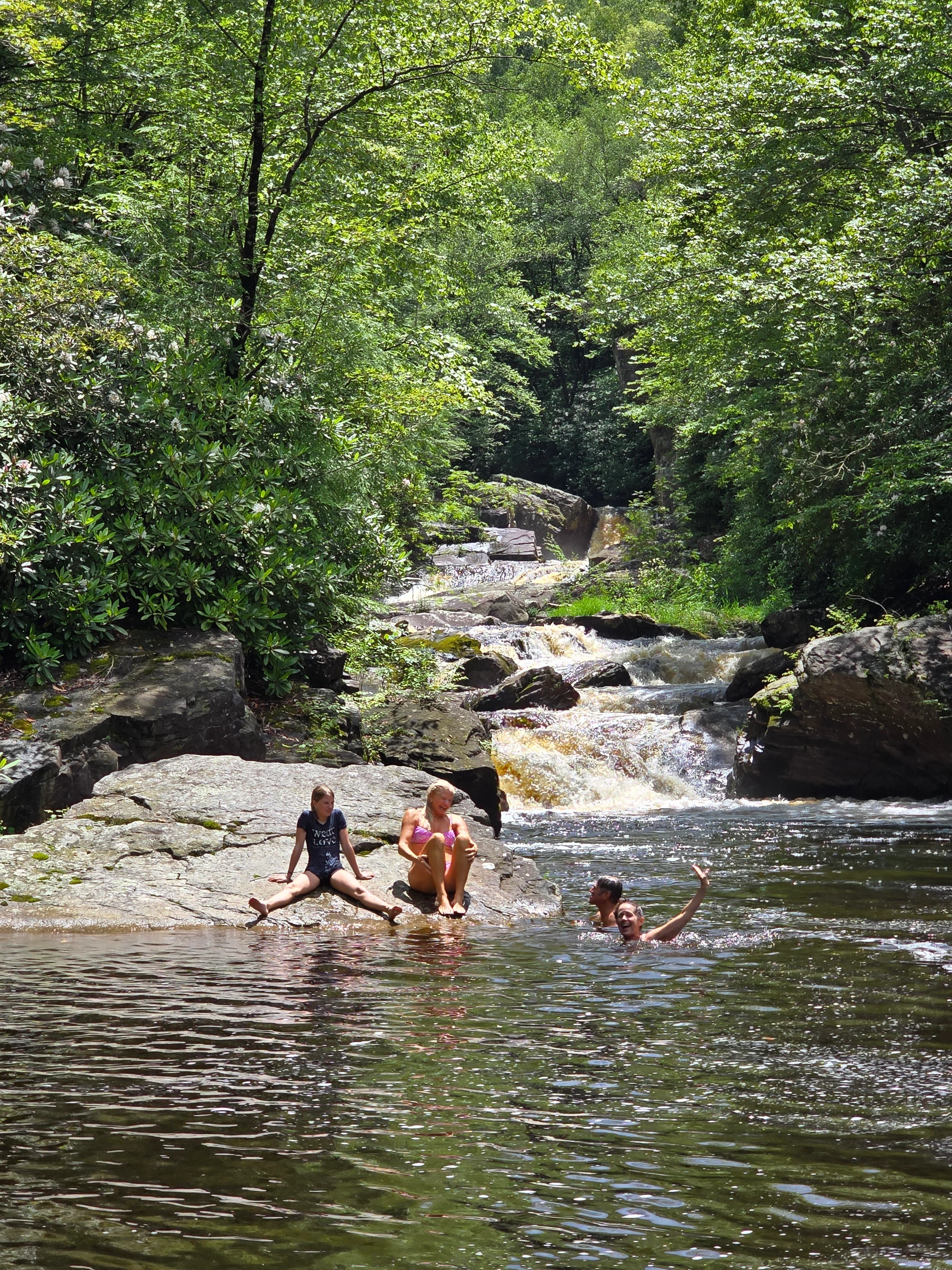 Family swimming in the river