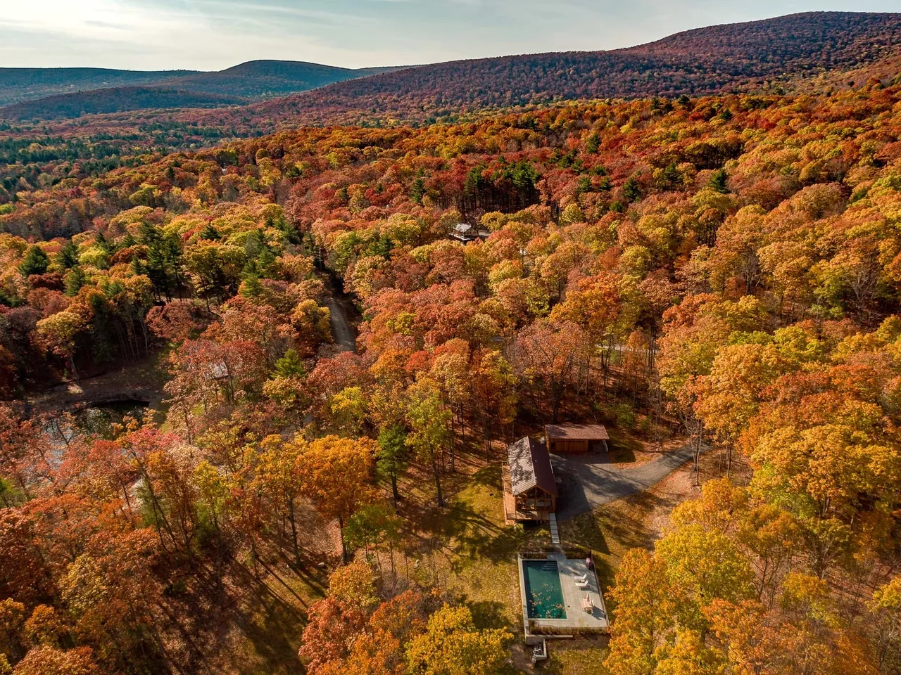 The lodge framed by autumn foliage